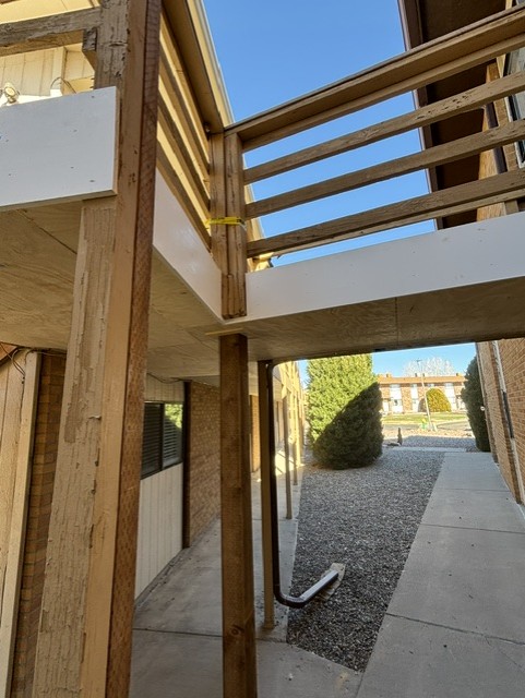 Rebuilt apartment staircase structure with new posts and framing